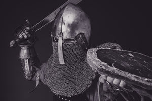 Renaissance Larp knight with a sword and shield in armor.